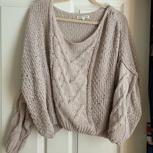 Cropped cable knit sweater
